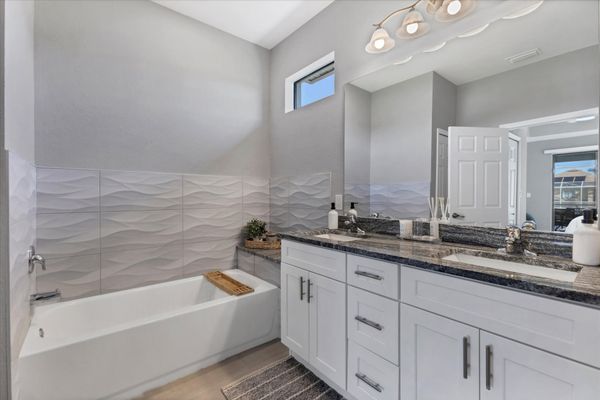 Primary bathroom with walk-in shower, soaking tub and double vanities