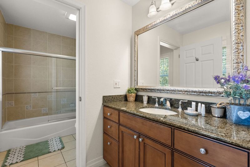Enjoy the convenience of an en-suite bathroom featuring a walk-in shower for a refreshing start to your day