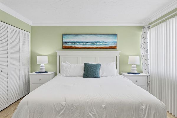 Primary bedroom featuring king bed and 32-inch Smart TV