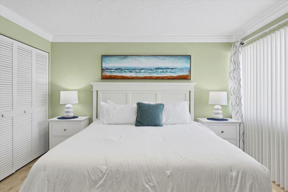 Primary bedroom featuring king bed and 32-inch Smart TV