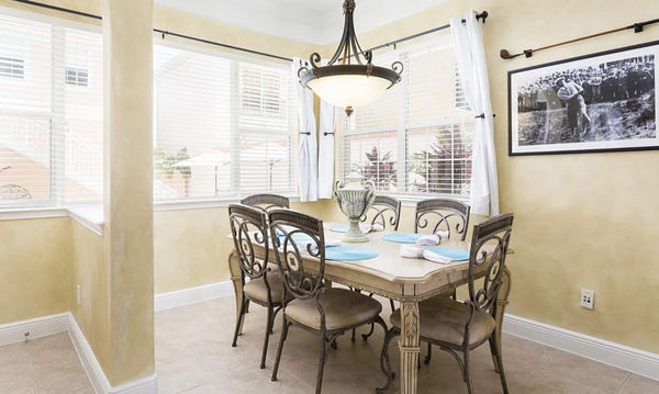 Dine in style at the formal dining table, which comfortably seats 10 guests for any occasion
