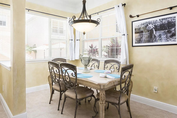 Dine in style at the formal dining table, which comfortably seats 10 guests for any occasion