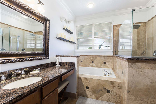 Unwind in the en-suite bath tub, offering a perfect retreat for a relaxing soak at the end of the day