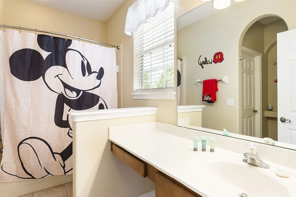 Enjoy the convenience of an en-suite bathroom featuring a walk-in shower for a refreshing start to your day