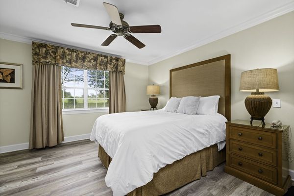 Retreat to the serene master bedroom, a spacious haven complete with luxurious furnishings and a tranquil ambiance
