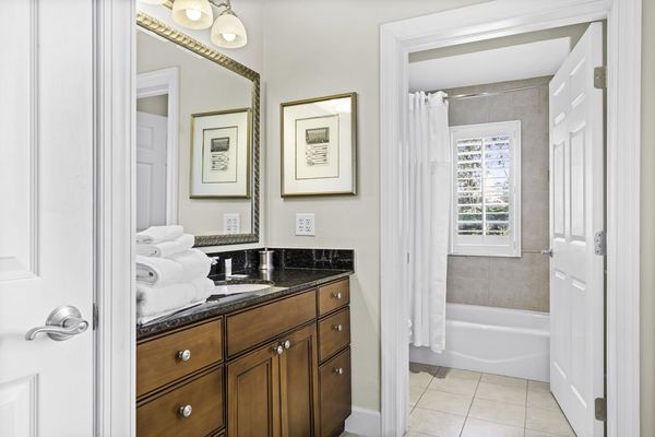 Enjoy the convenience of an en-suite bathroom featuring a walk-in shower for a refreshing start to your day