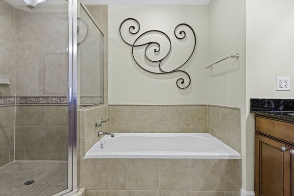 Relax in the inviting bathtub, providing a peaceful escape for a soothing soak after a long day
