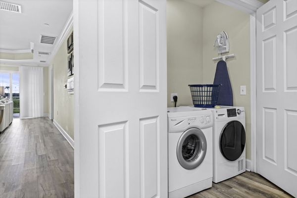 The ground floor laundry room has a set of washer and dryer