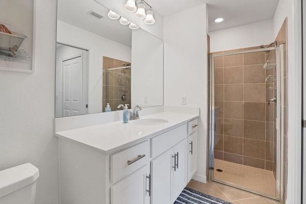 Primary attached bathroom with walk-in shower