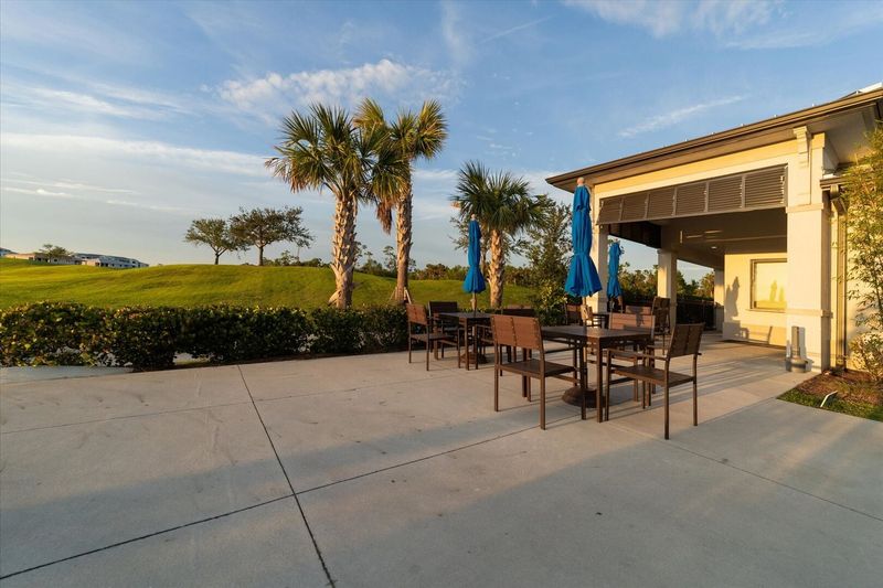 Outdoor seating at the Poolside tiki bar