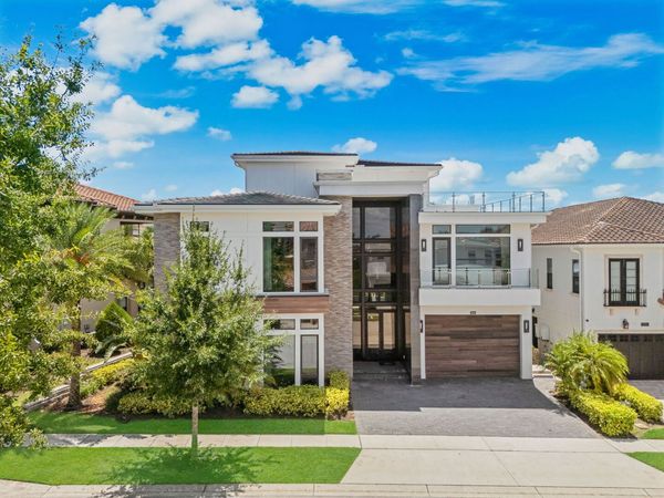This spectacular 8-bedroom estate in Reunion Resort will spark your creativity from the moment you step inside.
