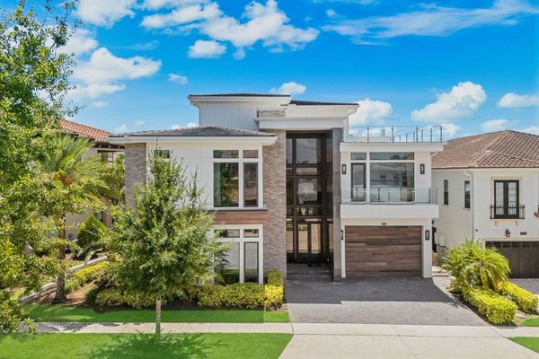 This spectacular 8-bedroom estate in Reunion Resort will spark your creativity from the moment you step inside.