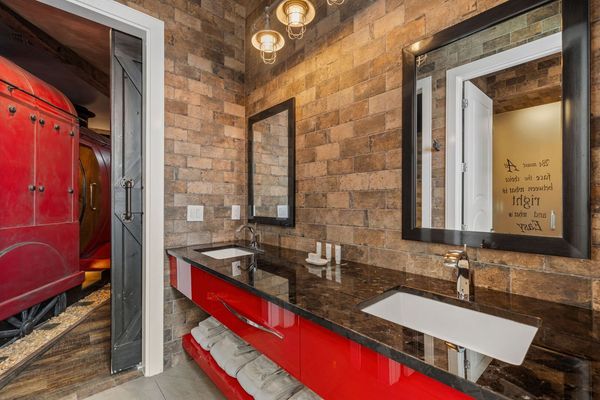 Train Station Bathroom with Double Vanities and Two Showers