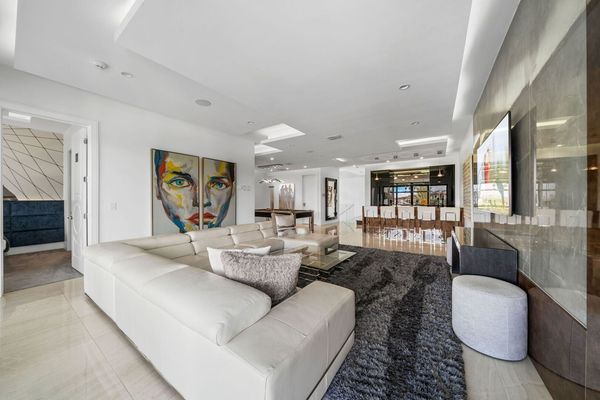 Second Floor Gathering Room with Modern Leather Sectional, Wet Bar, and Billiards