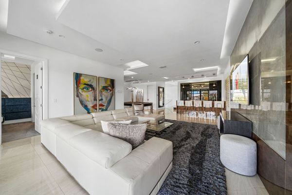 Second Floor Gathering Room with Modern Leather Sectional, Wet Bar, and Billiards