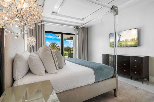 Master Bedroom 3 with Acrylic Canopy King Bed, 60 inch TV, and sitting area