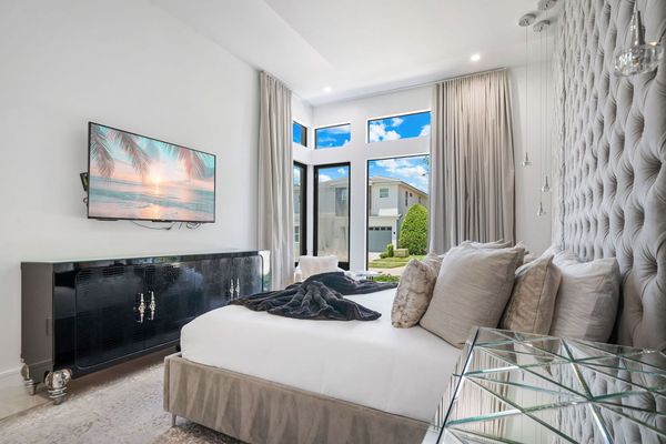 Bedroom 2 With Velvet Tufted Wall, King Size Memory Foam Bed and 60 inch TV