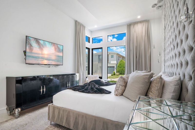 Bedroom 2 With Velvet Tufted Wall, King Size Memory Foam Bed and 60 inch TV