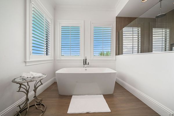 Relax in the inviting bathtub, providing a peaceful escape for a soothing soak after a long day