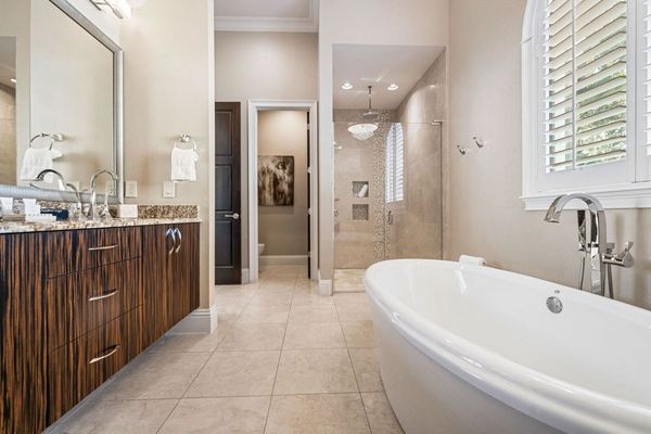Enjoy the convenience of an en-suite bathroom featuring a walk-in shower for a refreshing start to your day