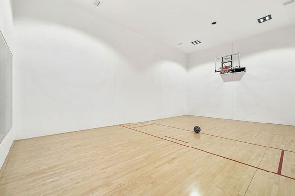 Retractable basketball net so squash and other games can be used