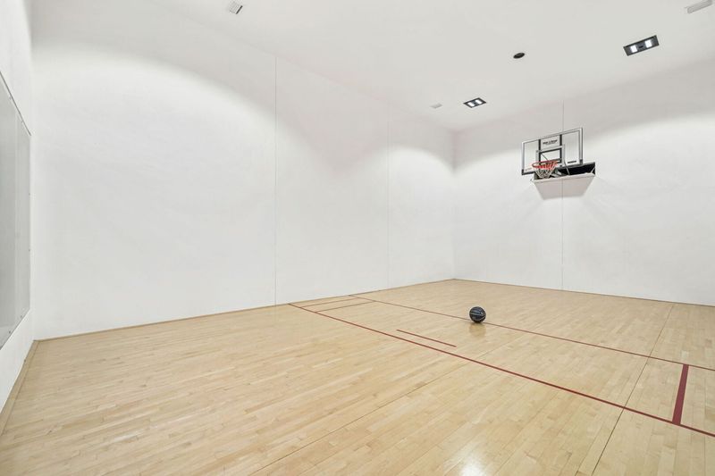 Retractable basketball net so squash and other games can be used