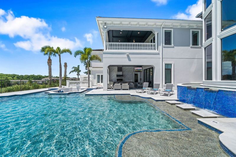 The privacy of this home is one-of-a-kind with simply nature surrounding your outdoor entertainment area and pool deck