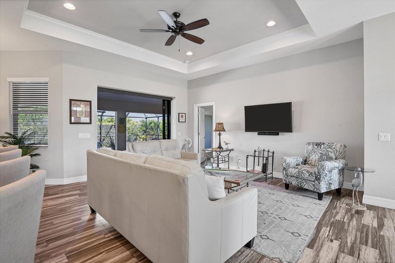 Beautiful open living space overlooking private pool & spa. Living room features comfy seating and 55-inch Smart TV