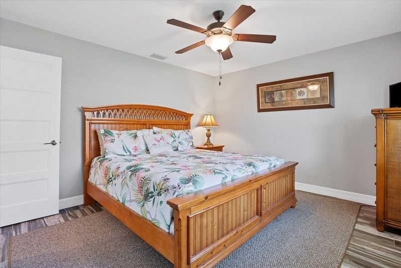 Guest bedroom 2 with queen bed and 32-inch Smart TV