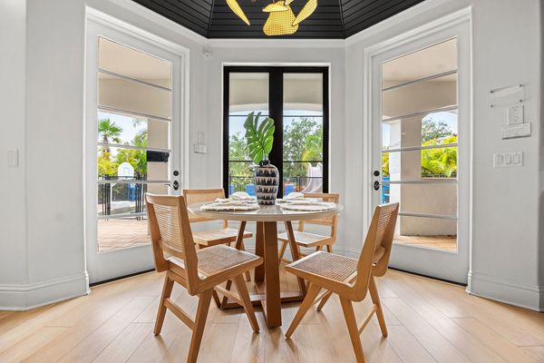 A cozy breakfast nook with seating for four offers a perfect spot for a casual morning coffee or late-night snacks.