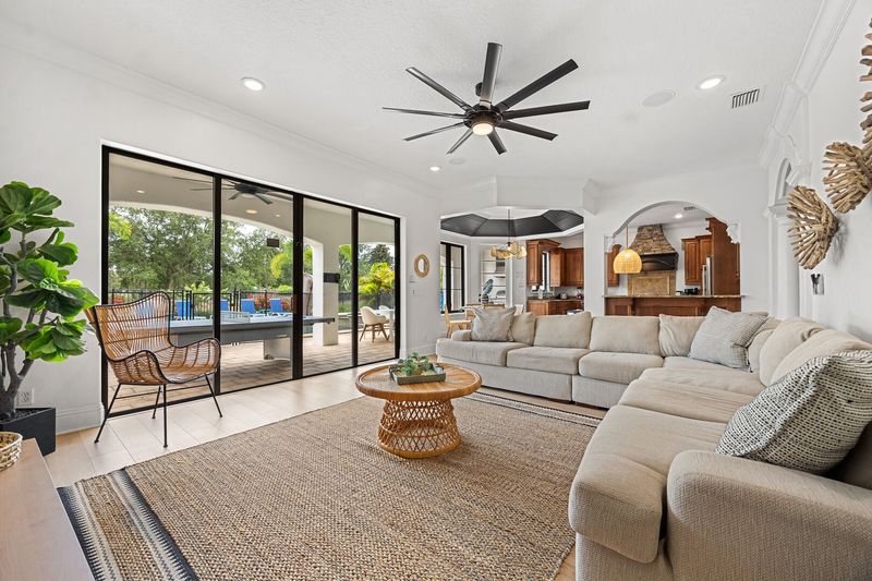 The living room, with its plush sectional sofa and accent chair, creates the ideal spot for the whole family to gather and share stories of the day's adventures.