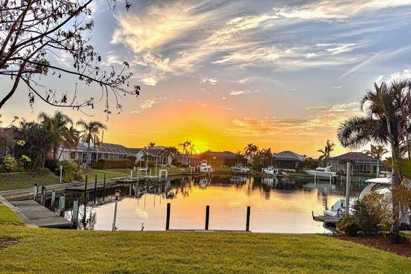 This charming residence features 40 feet of serene waterfront. The wide canal and spacious basin offer quiet waterfront living, complete with privacy from across-canal homes, no boat traffic or wakes. (Boat lift not available)