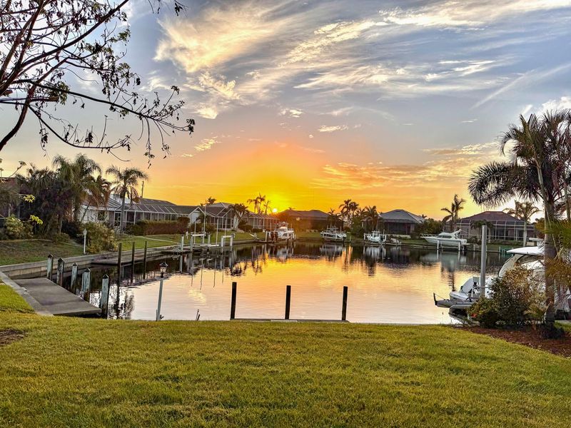 This charming residence features 40 feet of serene waterfront. The wide canal and spacious basin offer quiet waterfront living, complete with privacy from across-canal homes, no boat traffic or wakes. (Boat lift not available)