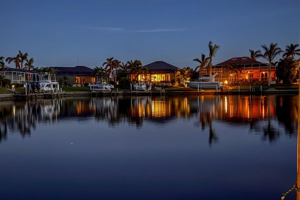 This charming residence features 40 feet of serene waterfront. The wide canal and spacious basin offer quiet waterfront living, complete with privacy from across-canal homes, no boat traffic or wakes.