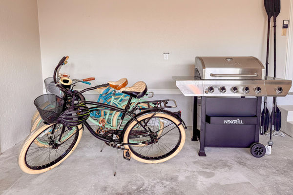3 bicycles and BBQ grill