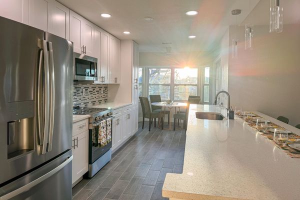 Bright, open, fully-equipped kitchen. Kitchen table seats 4 with the kitchen island seating an additional 4