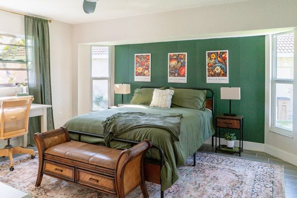 Primary bedroom featuring a queen bed and attached bathroom