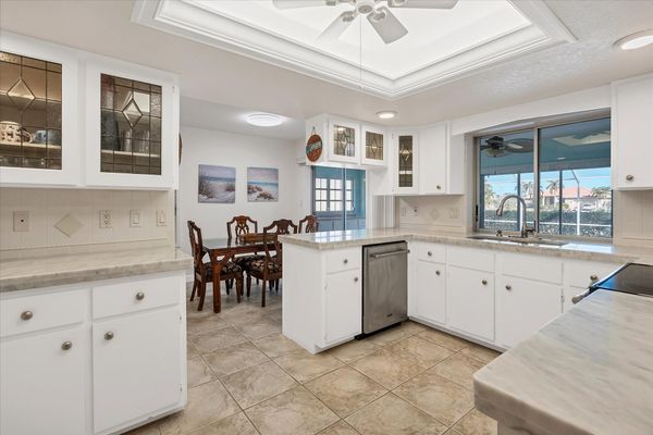 Bright, fully-equipped kitchen with plenty of countertop space and new stainless-steel appliances