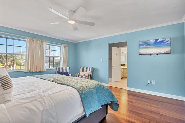Primary bedroom with king bed, attached bathroom and 40-inch Smart TV