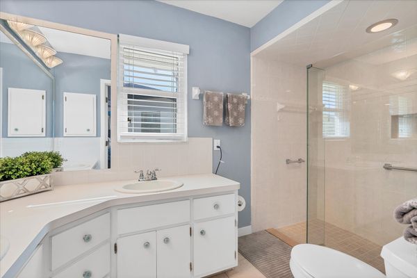 Primary bathroom with large walk-in shower and double vanities