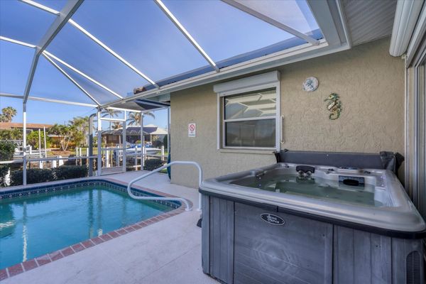 Sparkling pool and hot tub overlooking canal