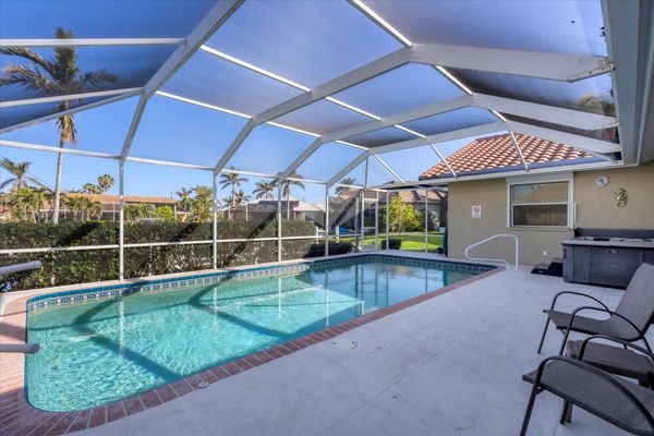 Sparkling pool and hot tub overlooking canal