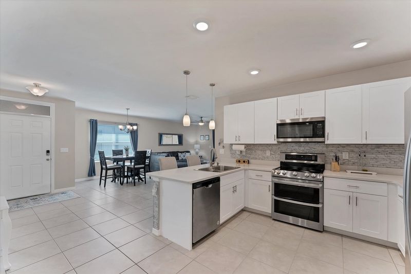 Fully-equipped kitchen overlooking the dining room and living room