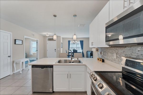 Fully-equipped kitchen overlooking the dining room and living room