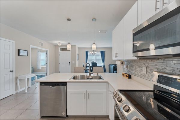 Fully-equipped kitchen overlooking the dining room and living room
