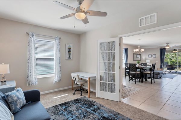 Den with twin futon, desk & chair, and Smart TV