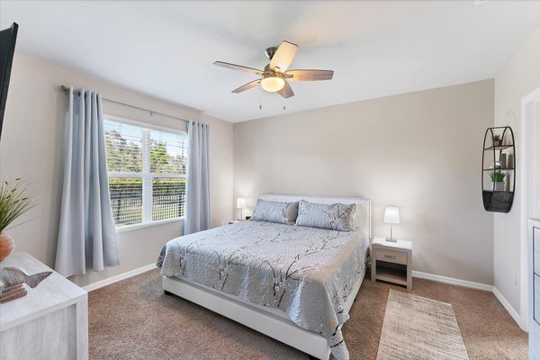 Primary bedroom with king bed and attached bathroom