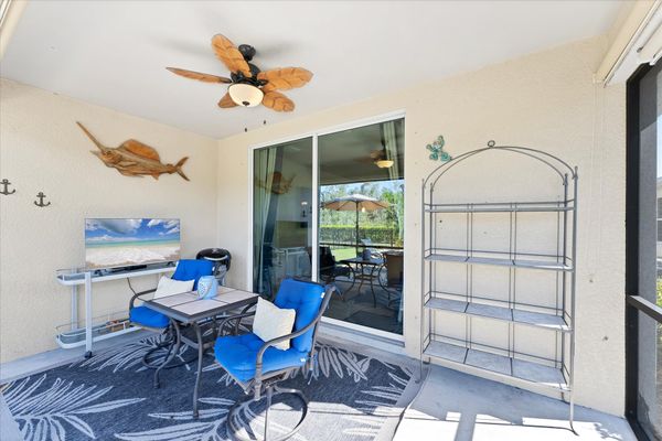 Enclosed patio overlooking fenced backyard