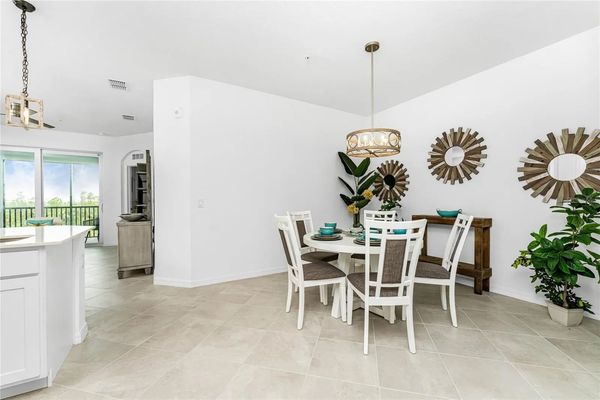 Dining table seats 5 with additional seating for 3 at kitchen island