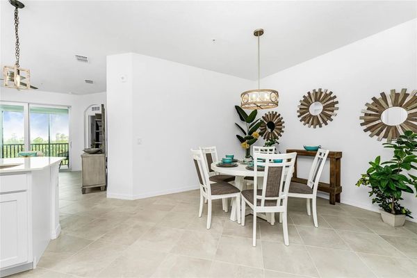 Dining table seats 5 with additional seating for 3 at kitchen island